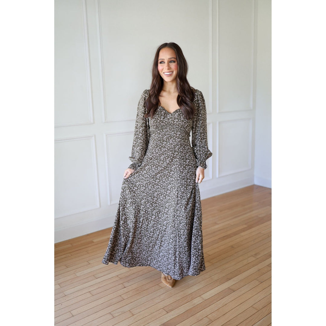 Woman wearing a long floral dress 