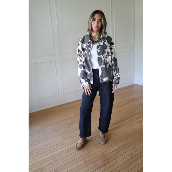 Black barrel jeans and animal print jacket
