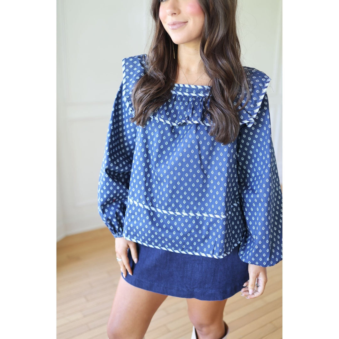 Woman wearing a blue  blouse 