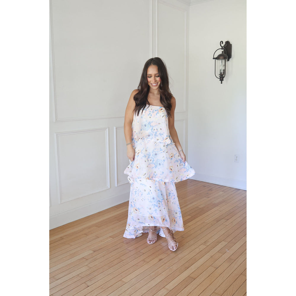 woman wearing yellow floral maxi dress
