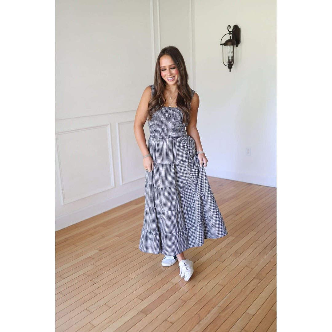 Woman wearing a blue checkered dress 