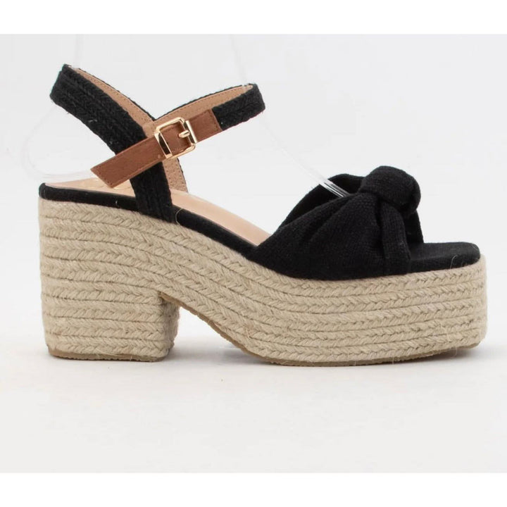 Black platform sandal with jute sole on a white background