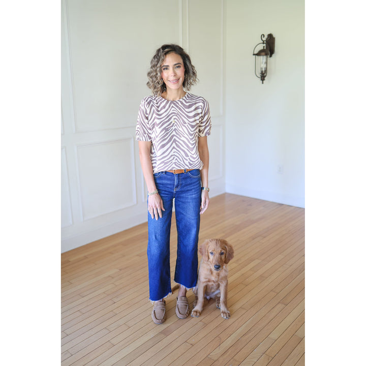 Woman standing with a dog 