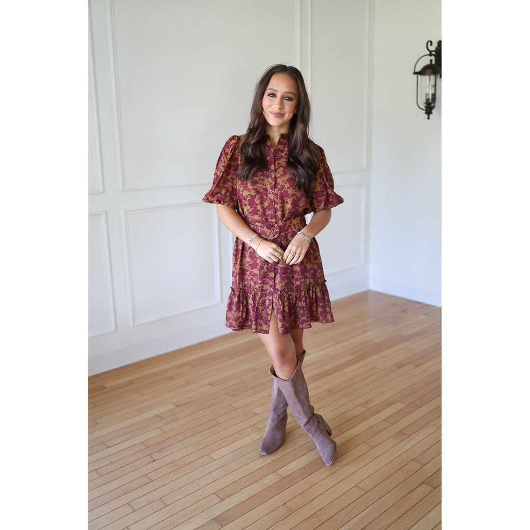 Woman wearing a floral dress and knee-high boots