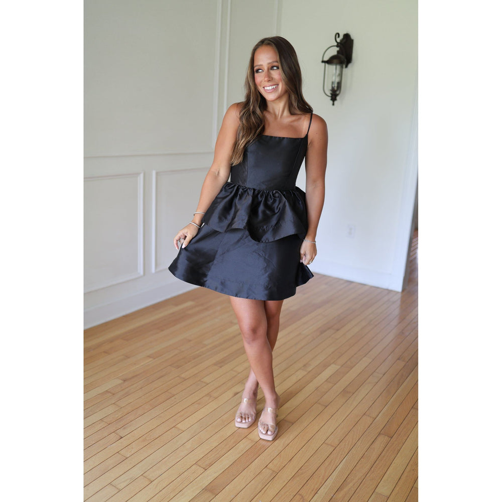 Woman wearing a black dress 
