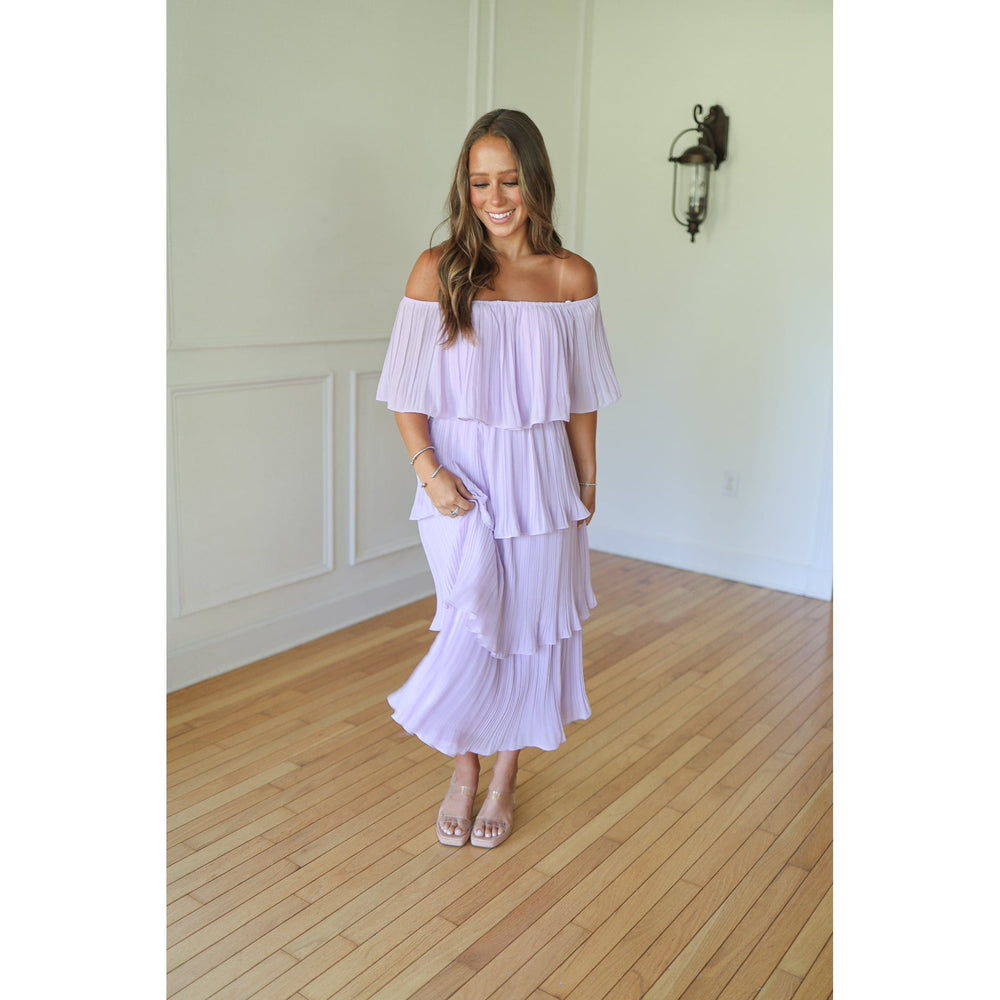 Woman wearing a light purple off-shoulder dress 