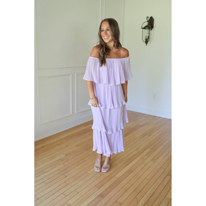 Woman wearing a light purple off-shoulder dress 
