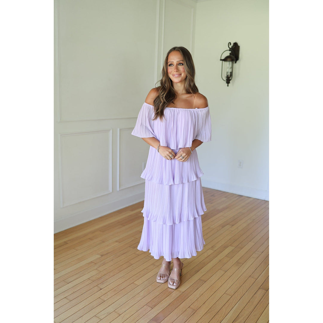 Woman wearing a light purple off-shoulder dress 
