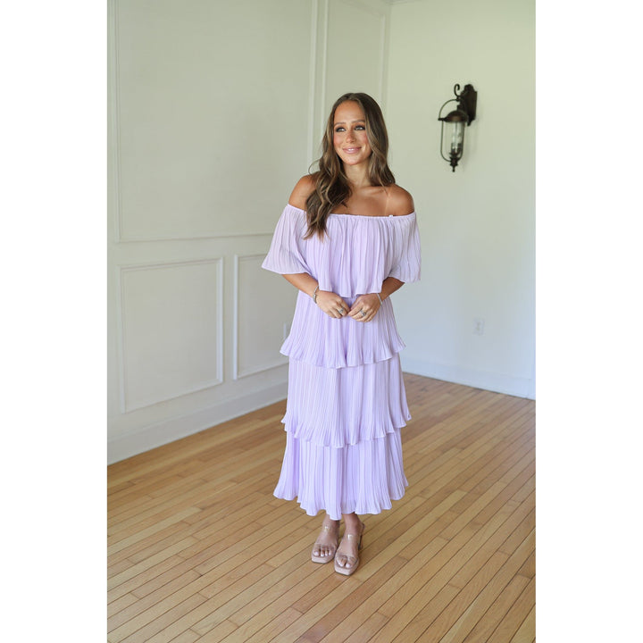 Woman wearing a light purple off-shoulder dress 