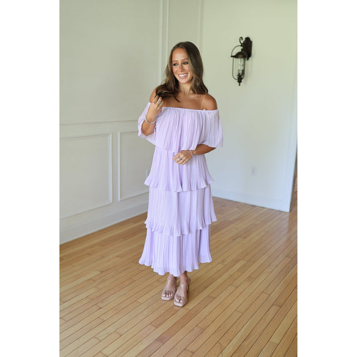 Woman wearing a light purple off-shoulder dress 