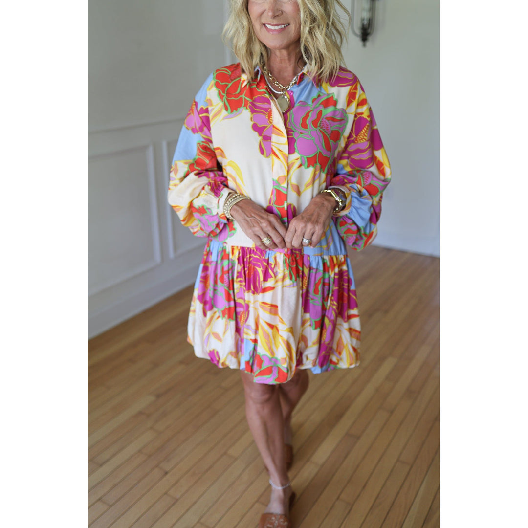 Woman wearing a colorful floral dress 