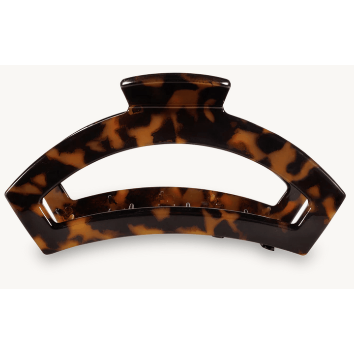Tortoiseshell patterned hair clip on a white background