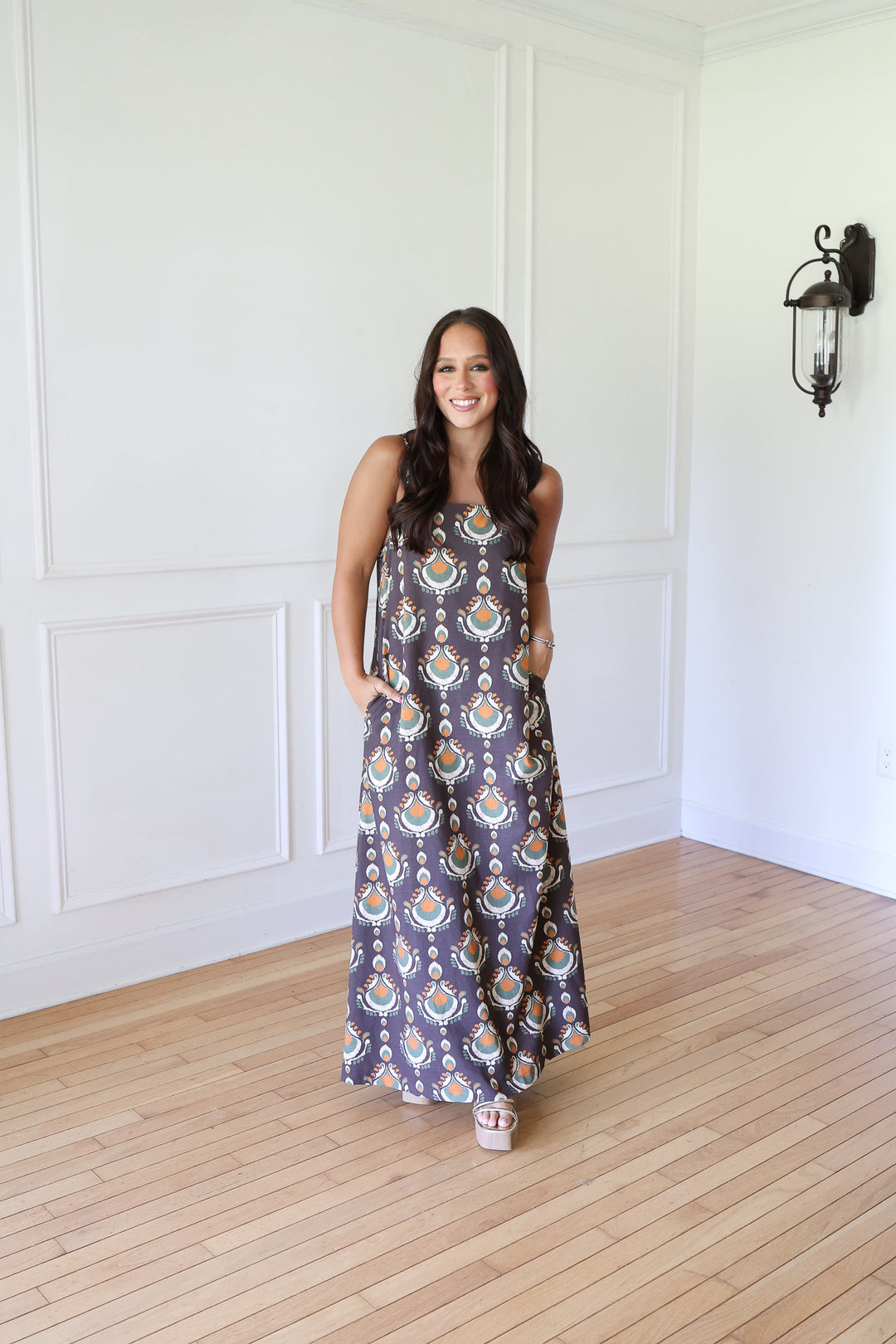 woman wearing brown print maxi dress