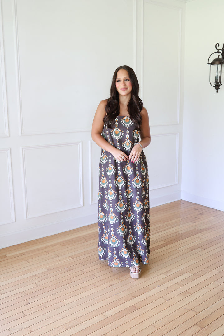 woman wearing brown print maxi dress