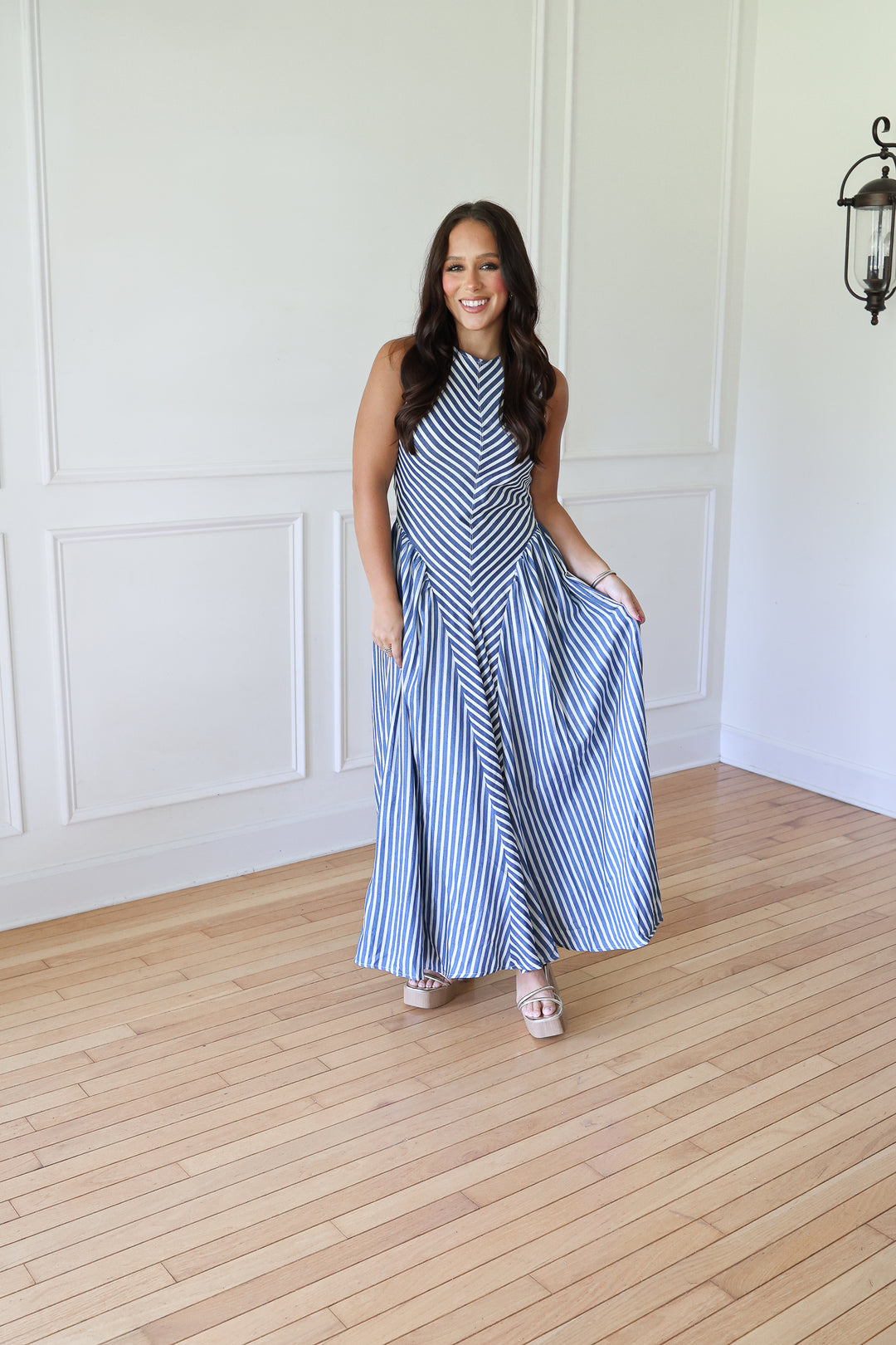 woman wearing denim striped maxi dress
