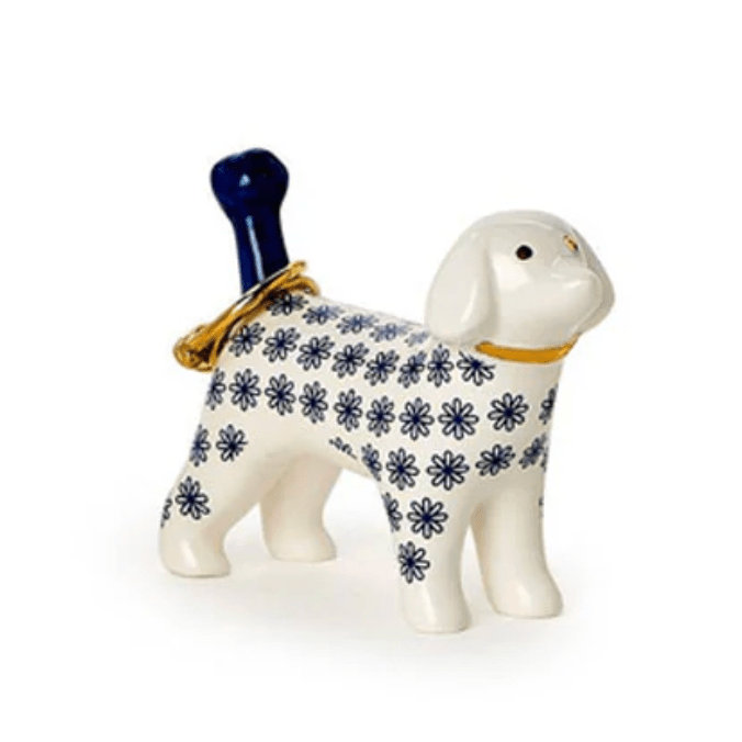 Ceramic dog-shaped bottle with blue floral pattern on a white background