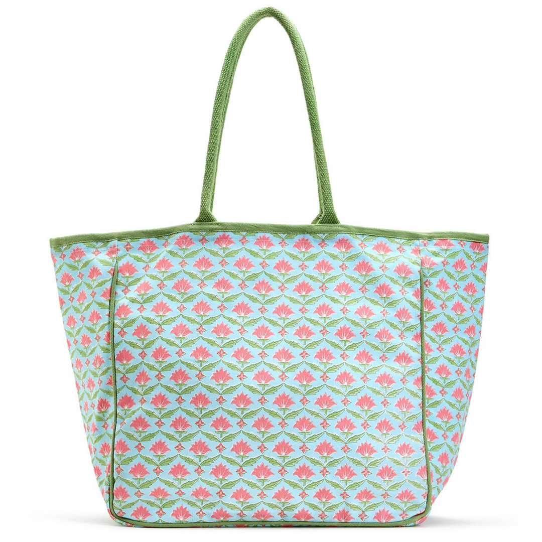 Floral patterned tote bag with green handle 