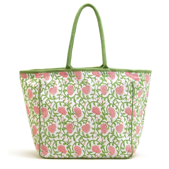 Floral patterned tote bag with green handle 