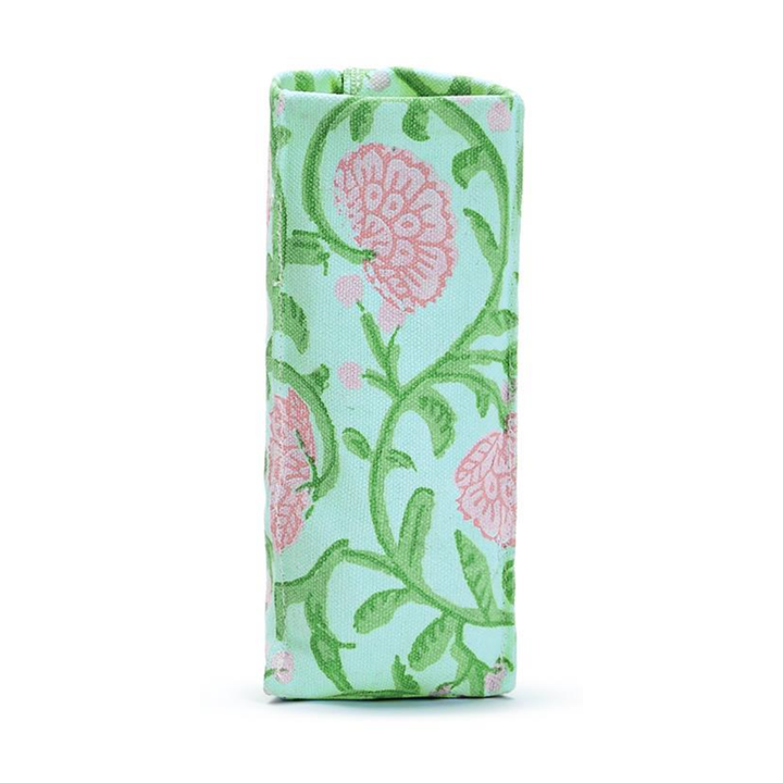 Folded fabric with pink floral pattern on a light blue background