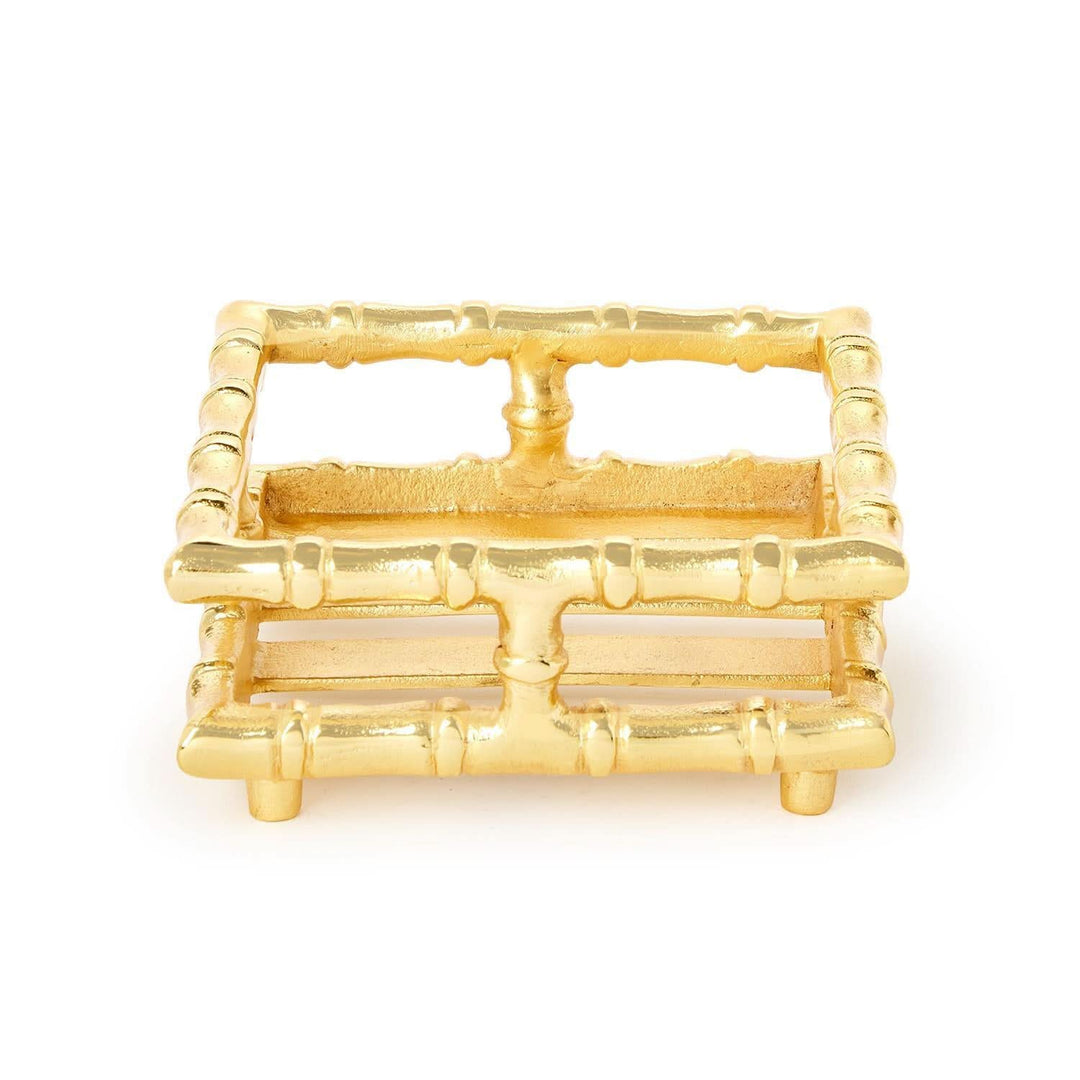 Gold bamboo-style trinket dish on a white background