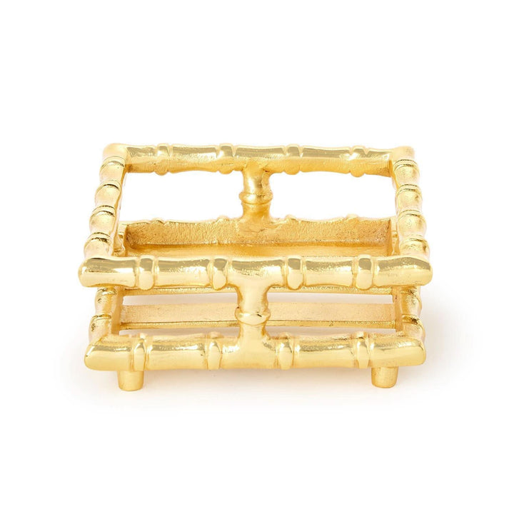 Gold bamboo-style trinket dish on a white background