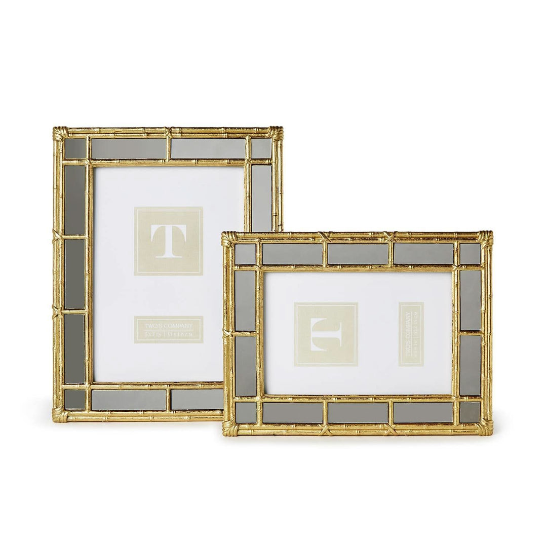 Two decorative picture frames with gold and glass design on a white background