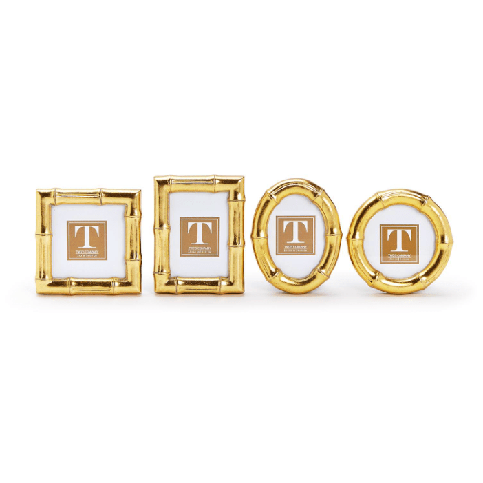 Set of four gold picture frames with a central 'T' logo on a white background