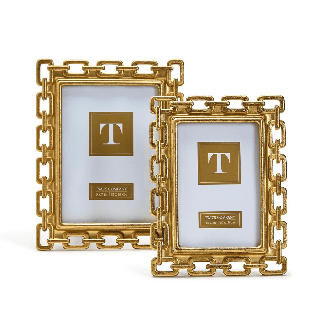 Two gold picture frames with a decorative chain design 