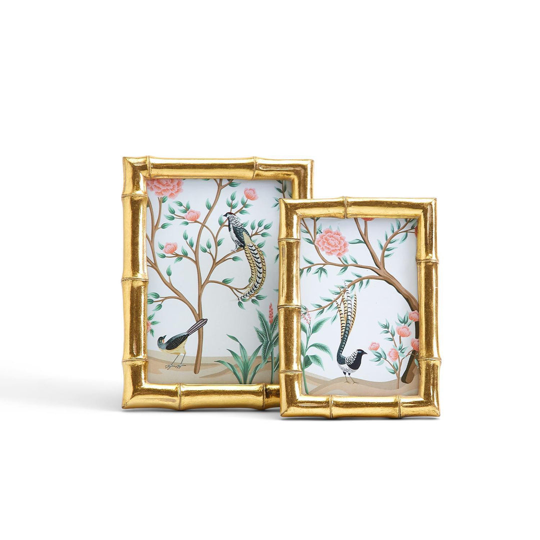 Two decorative picture frames with bamboo design and bird illustrations on a white background