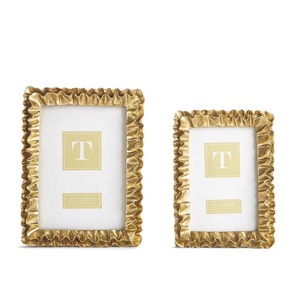 Two gold picture frames with decorative ruffled edges on a white background