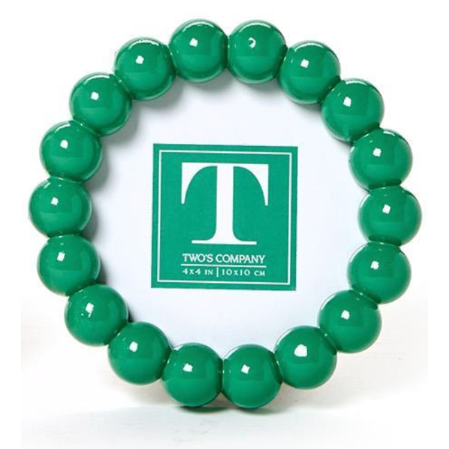 Green beaded bracelet with a 'TWO'S COMPANY' logo in the center 