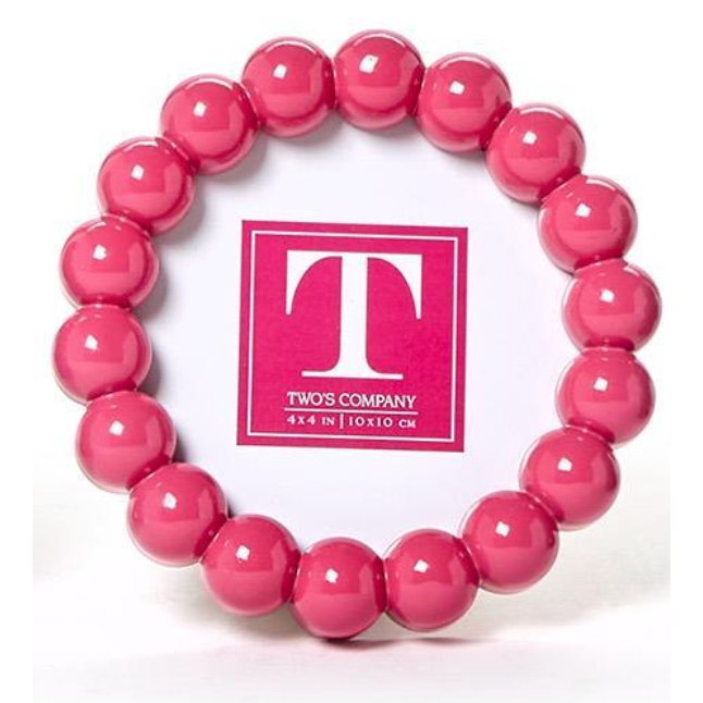 Pink beaded bracelet with 'Two's Company' logo in the center