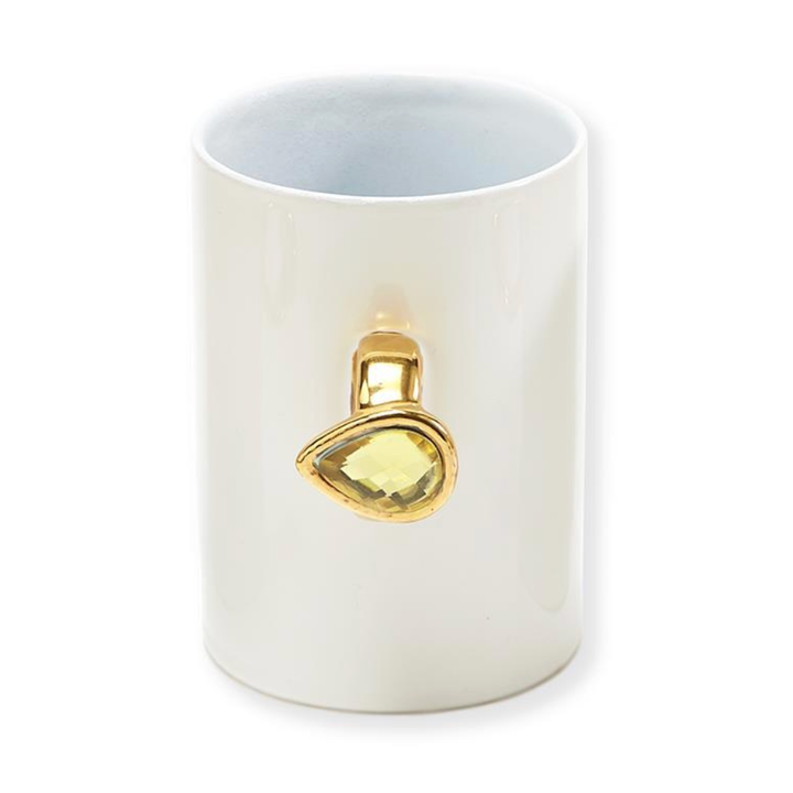 White mug with a gold and yellow gemstone