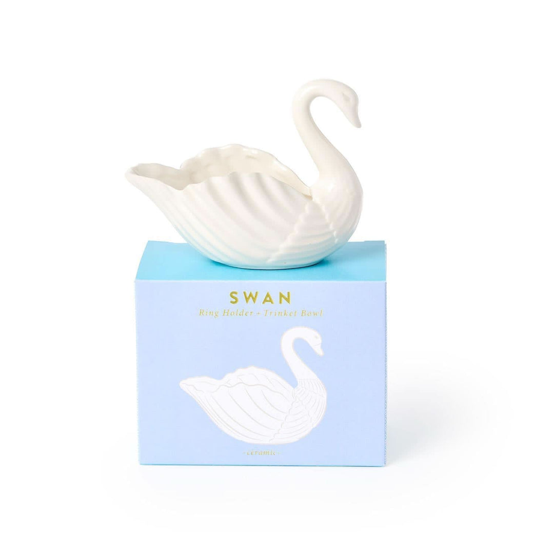 White swan-shaped object on a blue box with 'Swan' branding