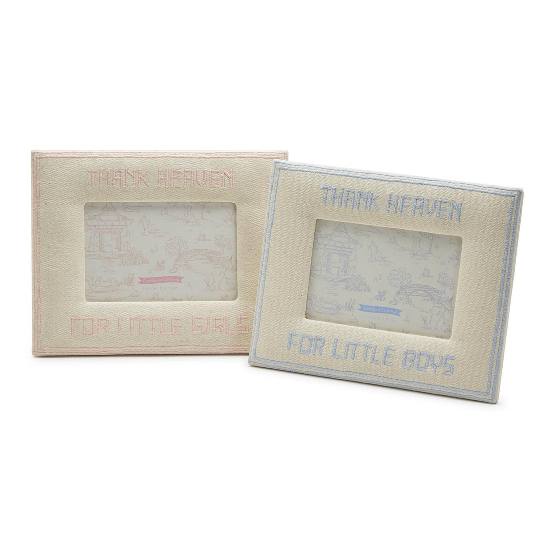 Two beige picture frames with text 'Thank Heaven for little girls' and 'Thank Heaven for little boys' 