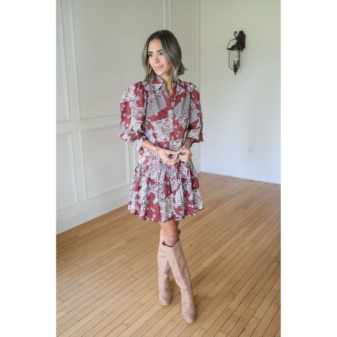 Woman wearing a red and white patterned dress 