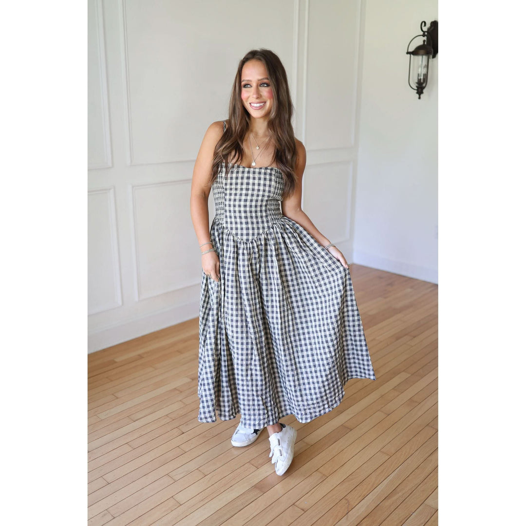 Woman wearing a black and white checkered dress 
